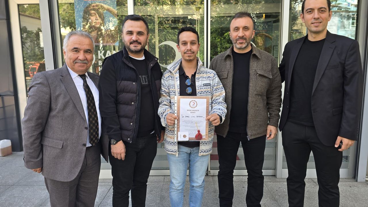 Emre Can Bayram'a 10'ncu kan bağışı madalyası!