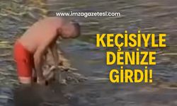 Orta Kapuz’da ilginç görüntü! Keçisiyle deniz keyfi yaptı