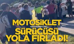 Otomobilin çarptığı motosiklet sürücüsü yola fırladı