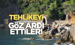 TEHLİKEYİ GÖZ ARDI ETTİLER: ZONGULDAK KAYALIKLARDAN DENİZE ATLADILAR, RİSK BÜYÜYOR!