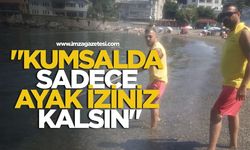 Kapuz Plajı'nda sabah temizliği... "Kumsalda sadece ayak iziniz kalsın"