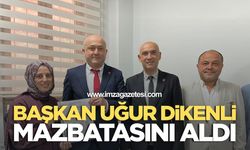 BAŞKAN UĞUR DİKENLİ MAZBATASINI ALDI