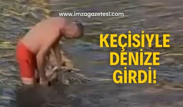 Orta Kapuz’da ilginç görüntü! Keçisiyle deniz keyfi yaptı