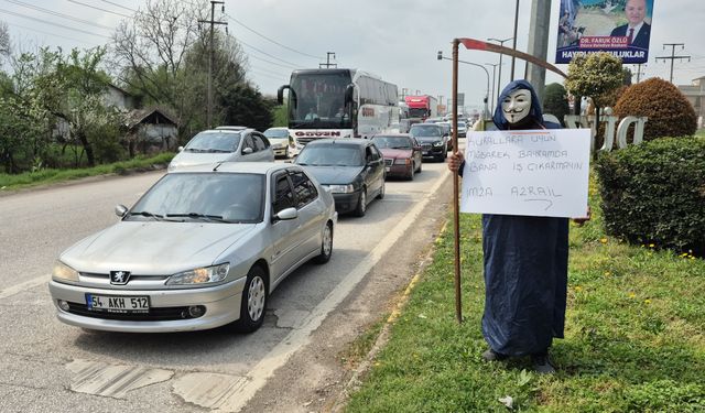 Sürücülere maskeli ve tırpanlı uyarı