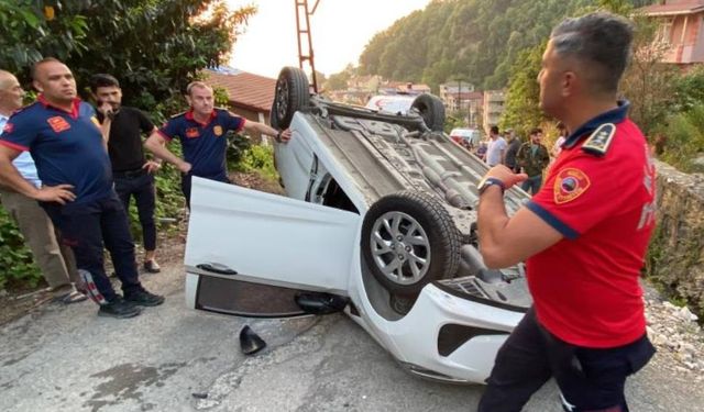 Takla atan araçtan yara almadan kurtuldular...